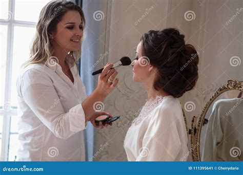 Makeup Artist Preparing Beautiful Bride before the Wedding in a Morning ...