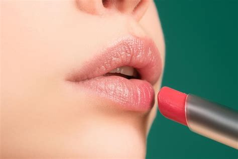 Premium Photo | Lips lipstick closeup applying makeup on lip pampering ...