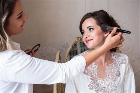 Makeup Artist Preparing Beautiful Bride before the Wedding in a Morning ...