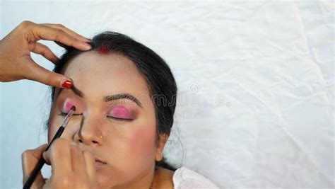 Makeup Artist Doing Bridal Make Up Applying Eye Shadow. Beautiful Bride ...