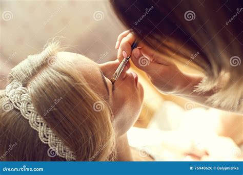 Young Beautiful Bride Applying Wedding Make-up Stock Photo - Image of ...