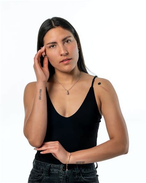 Elegant Portrait of Confident Woman in Black Top · Free Stock Photo