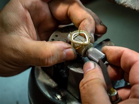 Premium Photo | Close-up of hand making jewelry
