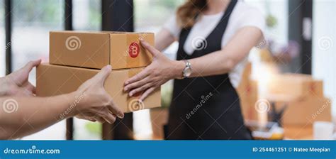 Customer Receiving a Cardboard Boxes Parcel from Delivery Man in the ...