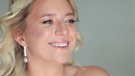 Radiant Smiling Bride with Elegant Jewelry, A close-up shot of a ...