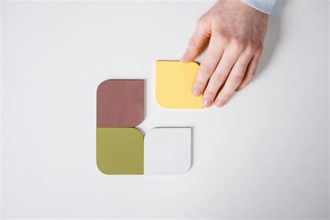 A Person Touching an Object on White Surface · Free Stock Photo