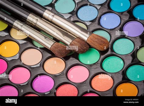 Three makeup brushes on colorful eyeshadow makeup palette Stock Photo ...