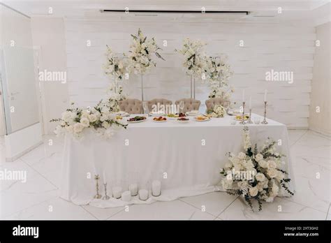 Elegant wedding reception setup with luxurious floral arrangements and ...