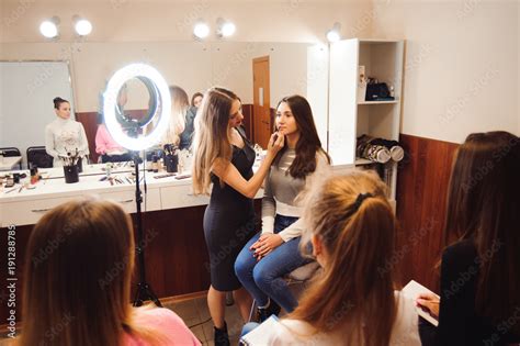 professional makeup teacher training her student girl to become makeup ...
