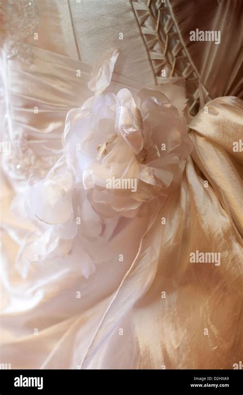 Detail of a wedding dress with colors from a fabric Stock Photo - Alamy
