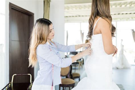Stylist Preparing Bride for Her Wedding Day Stock Photo - Image of ...
