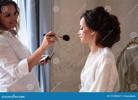 Makeup Artist Preparing Beautiful Bride before the Wedding in a Morning ...