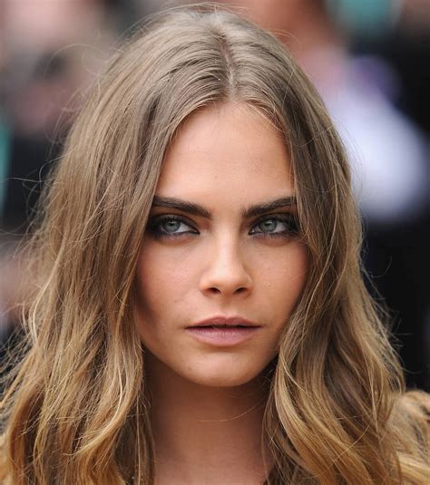 Close-up of Cara Delevingne rocking a smudged eyeliner makeup look on ...
