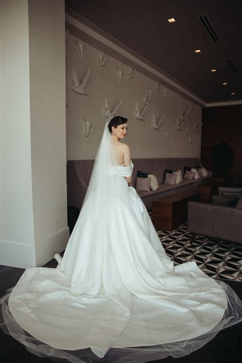 How does bespoke artistry enhance natural beauty for timeless bridal elegance?