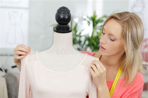 Young Tailor Adjusting Dress on Mannequin Stock Image - Image of design ...